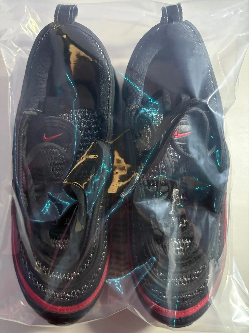 Unisex Nike AirMax (6) Black Sneakers with Red Trim.